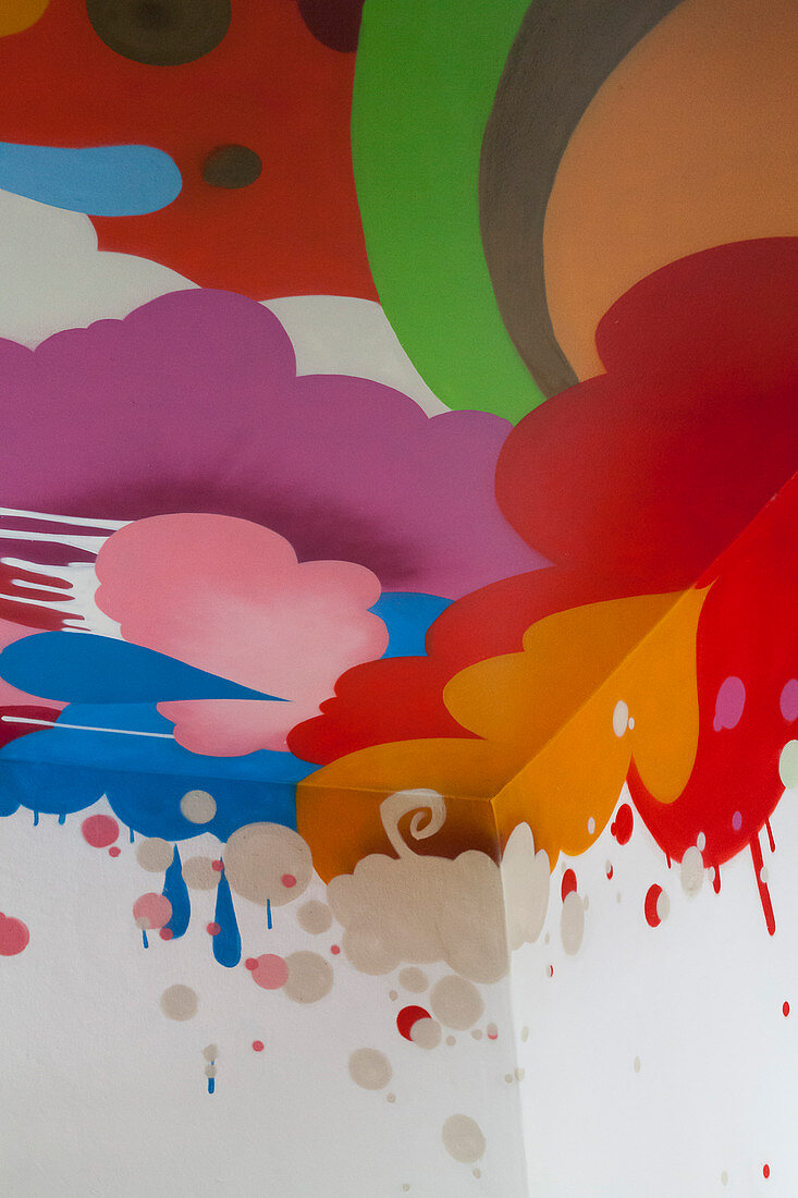 Ceiling painted with multicoloured clouds, droplets and shapes