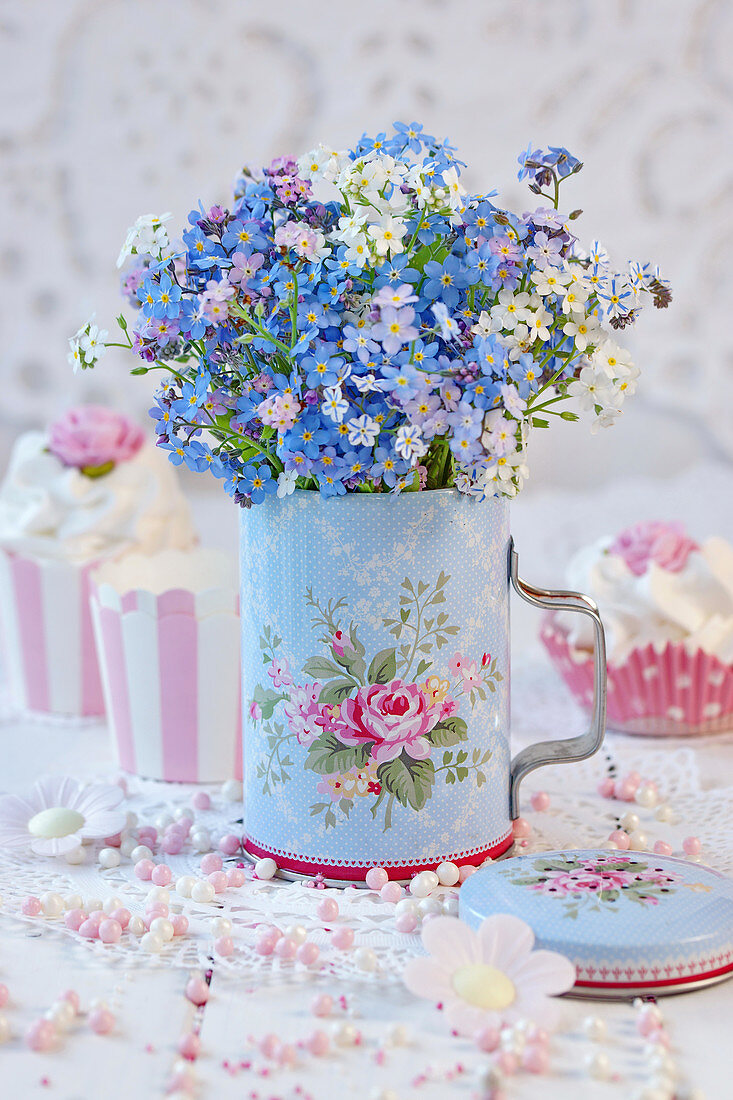 Bouquet of forget-me-nots in metal can