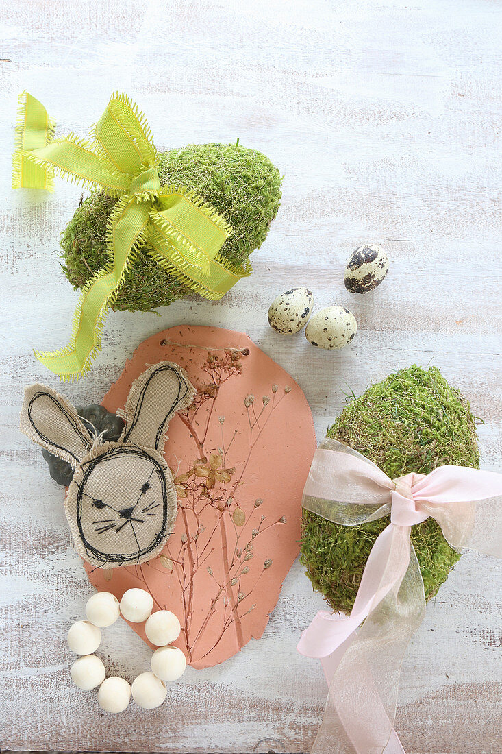 Stitched Easter bunny, modelling clay with botanical imprints and moss eggs