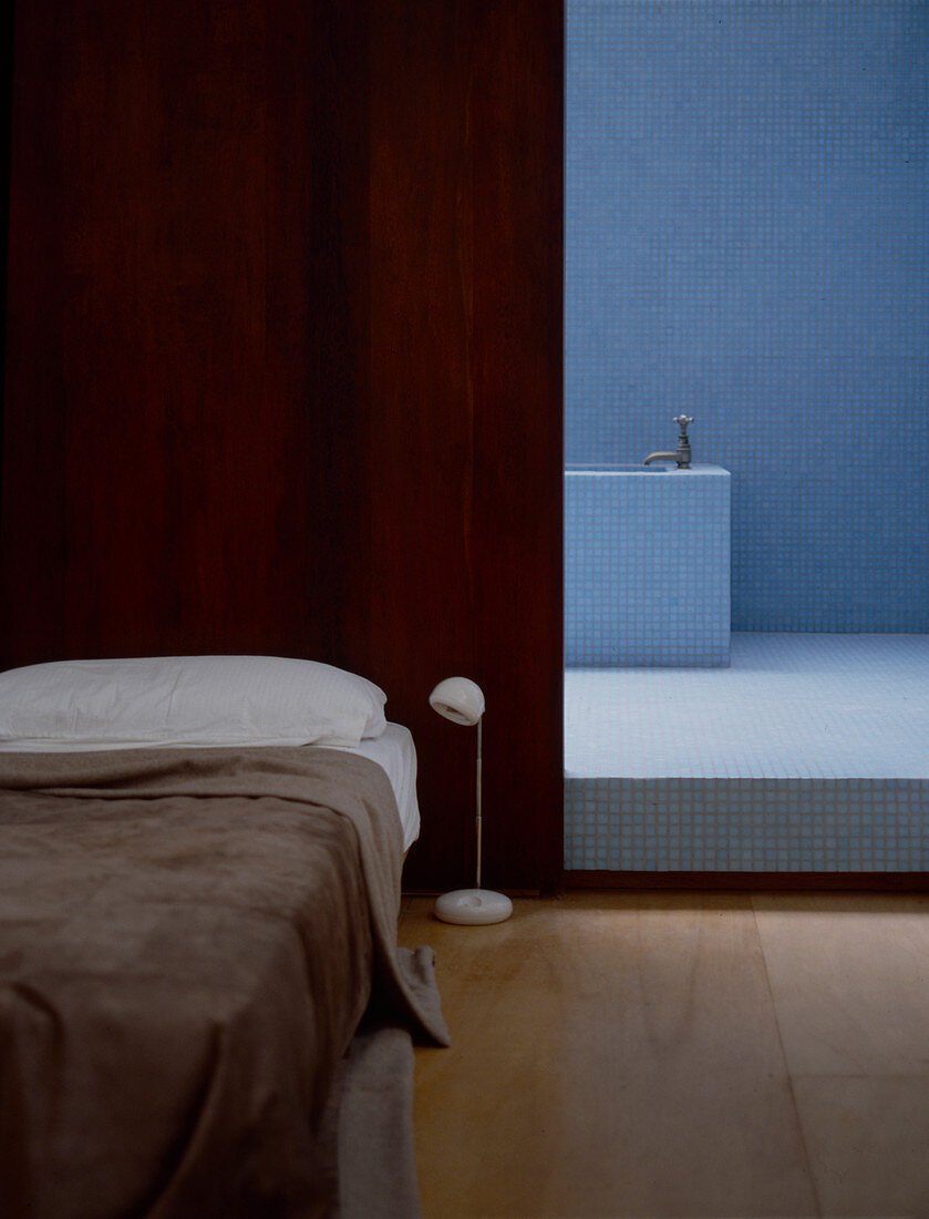 Mosaic tiles in ensuite bathroom of minimalist bedroom