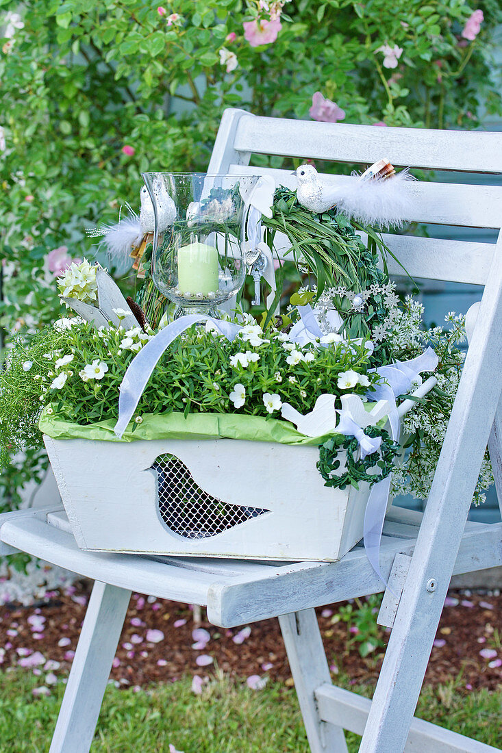 White-flowering plants planted in wooden basket as wedding present