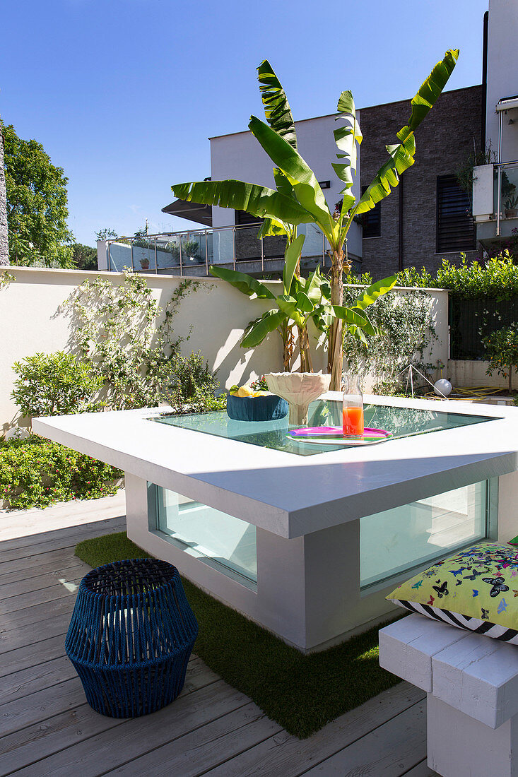 White table with glass insert on terrace