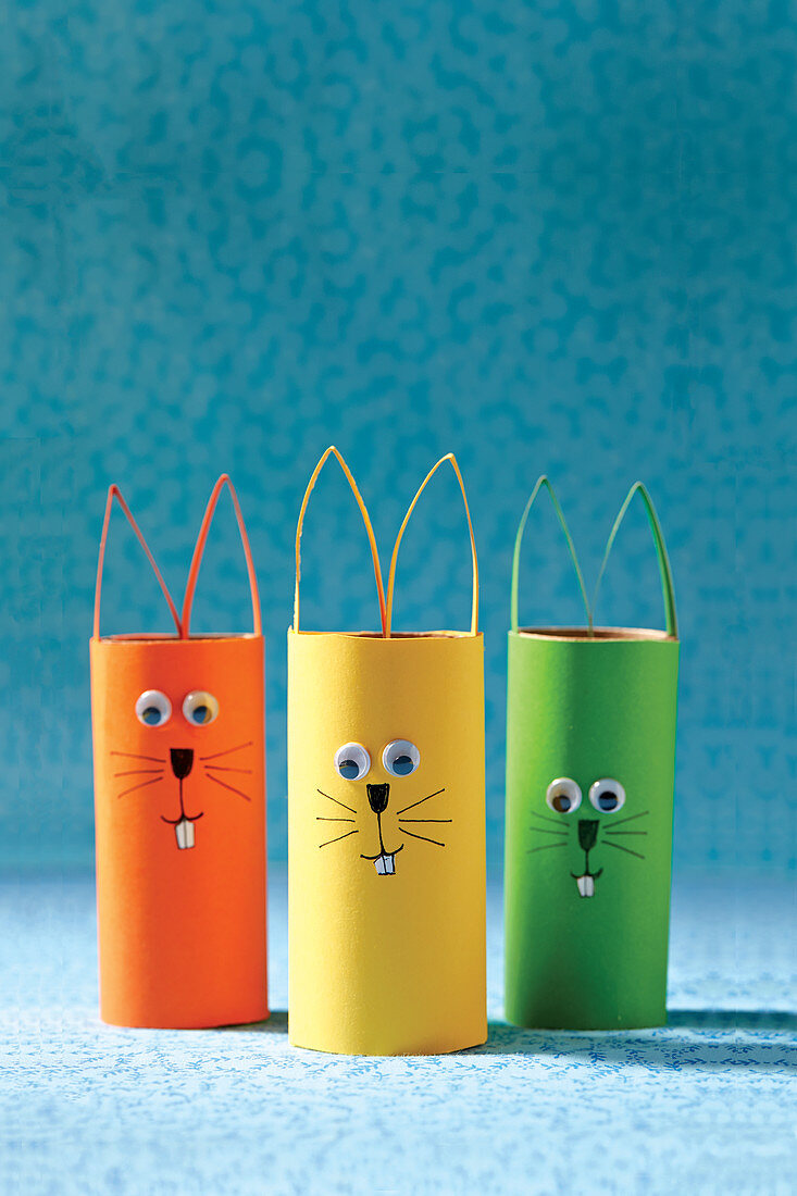 Easter bunny decorations made from paper rolls and googly eyes