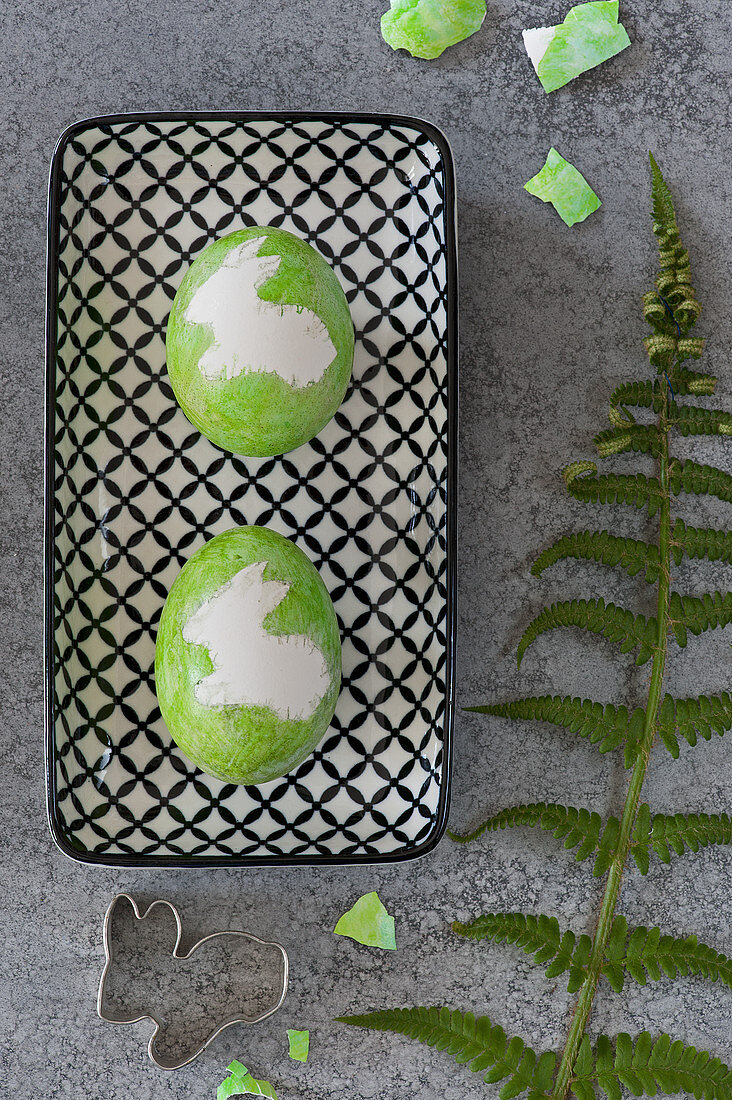 Green Easter eggs with Easter bunny motifs
