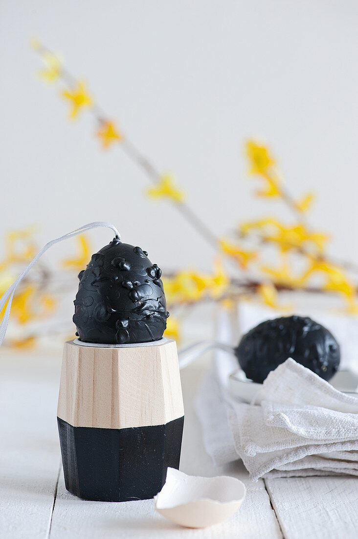 Blown egg decorated with chalkboard paint and black wax