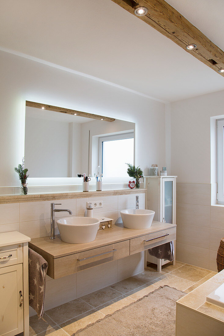 Backlit mirror in beige, modern bathroom