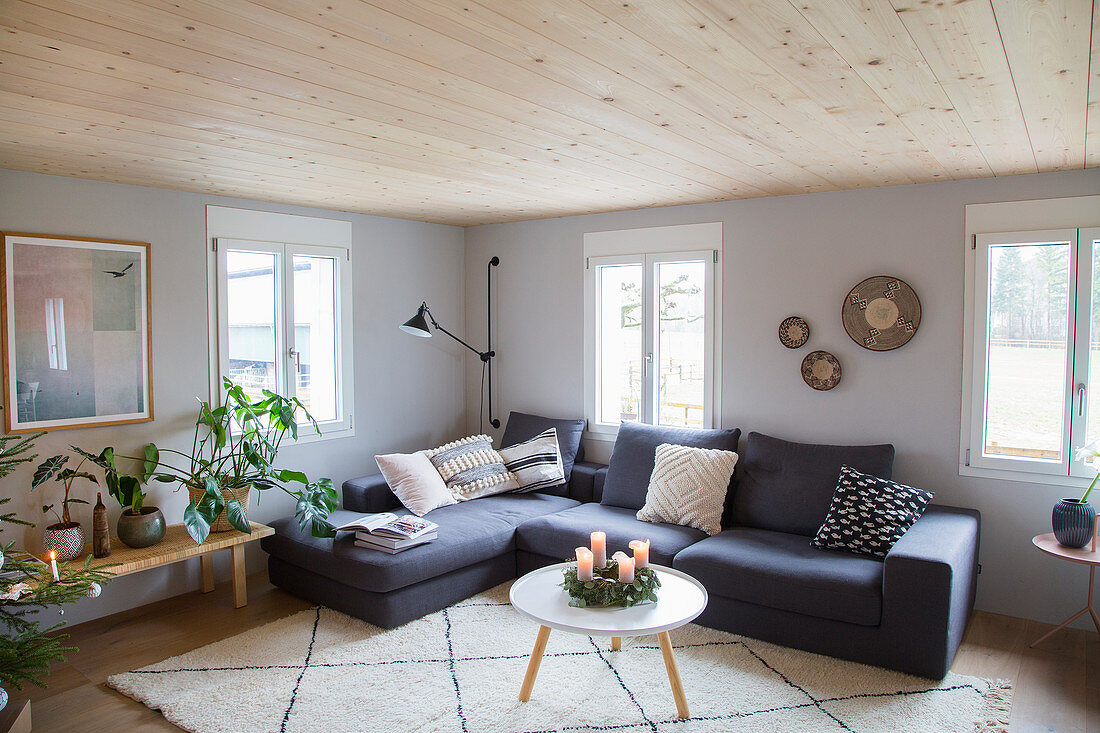Grey corner sofa in Scandinavian-style living room