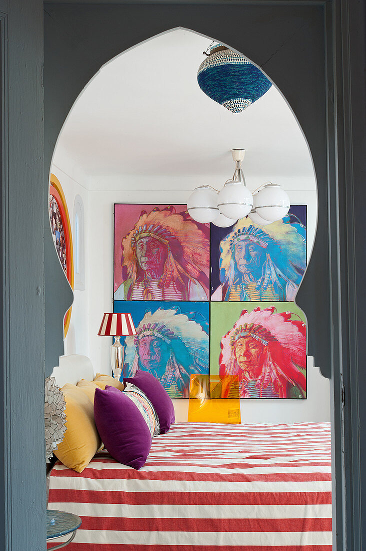 Oriental doorway leading into brightly decorated bedroom