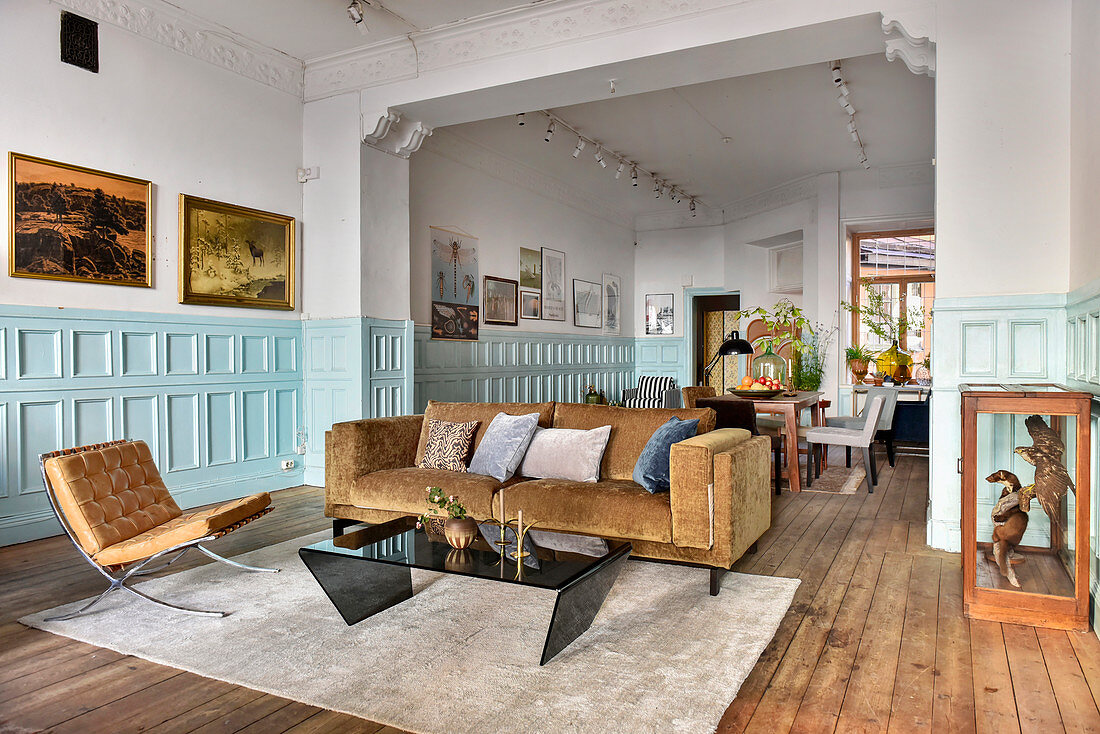 Living room and dining room and pale blue panelled wainscoting