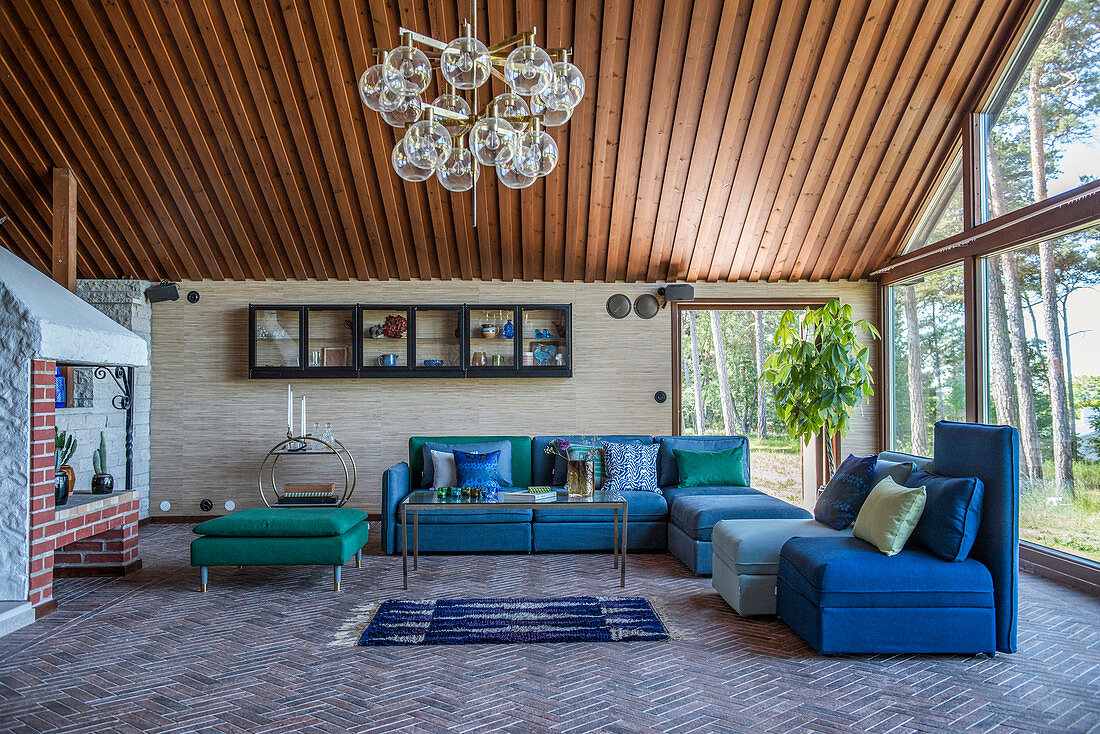 Modular sofas and chairs in shades of blue and green in living room