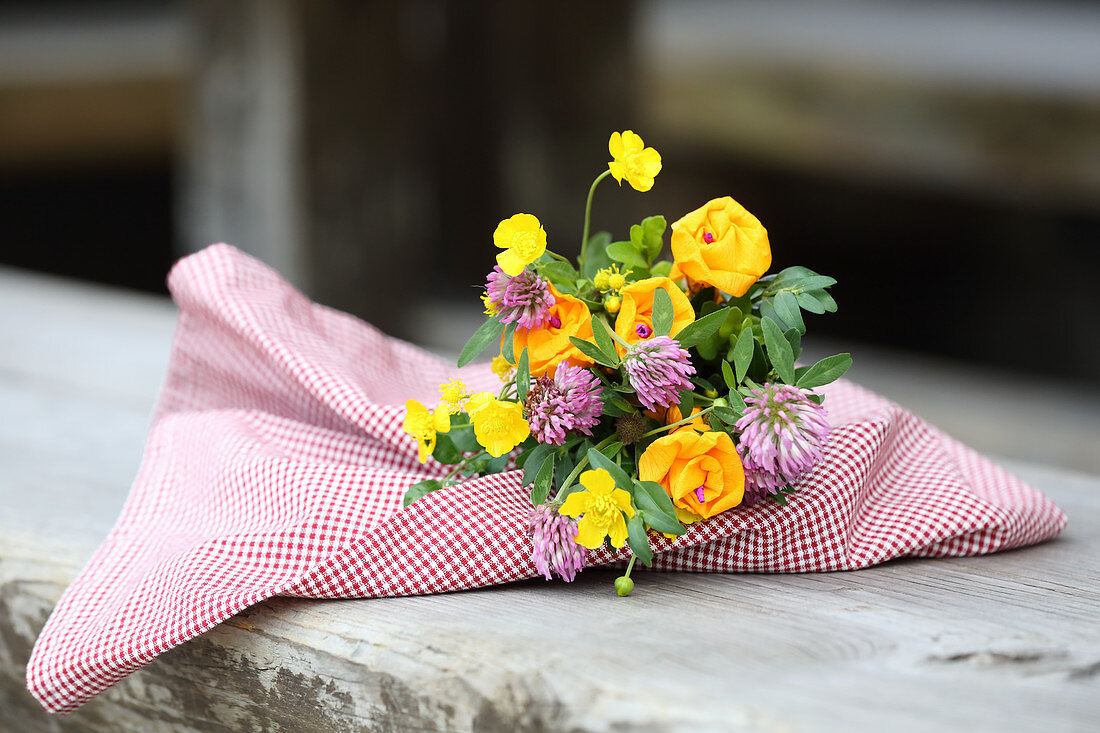 Posy of real and paper flowers