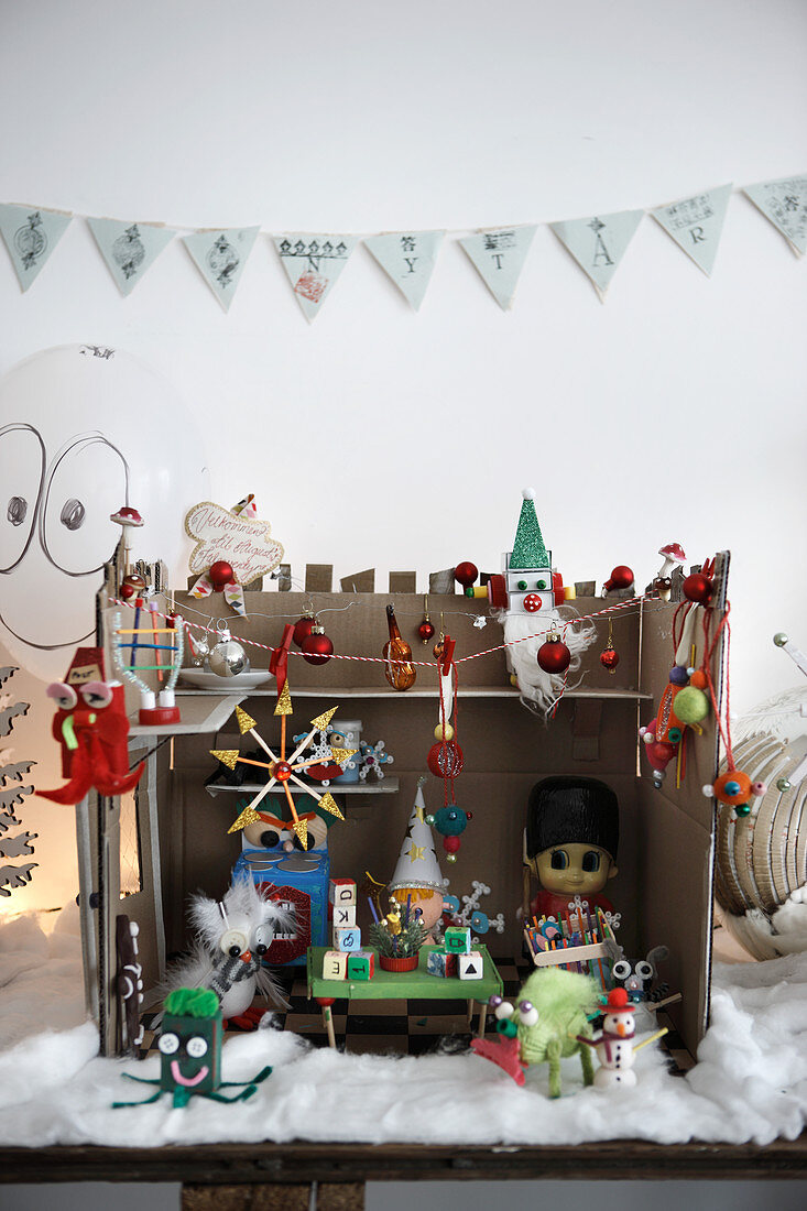 Handmade Christmas workshop diorama made from kitsch knick-knacks
