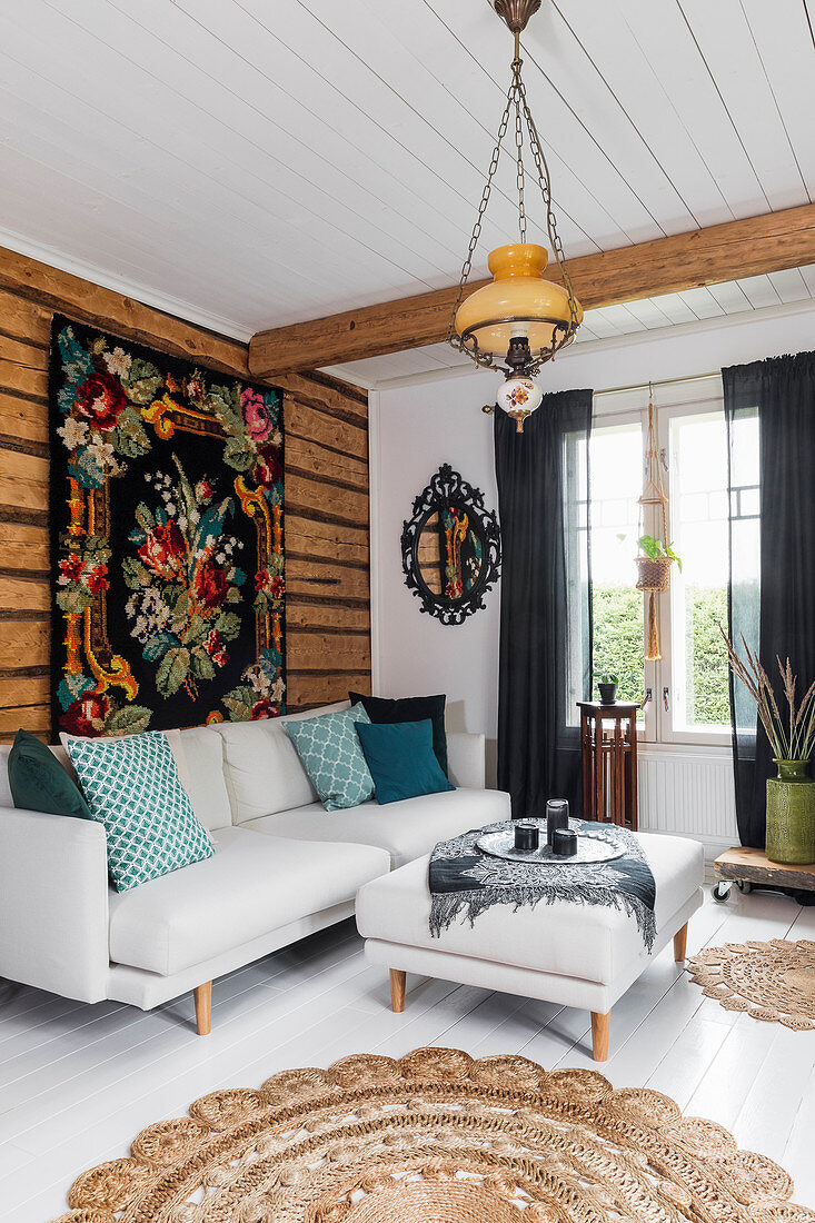 Tapestry hung on wall above sofa in Bohemian-style living room
