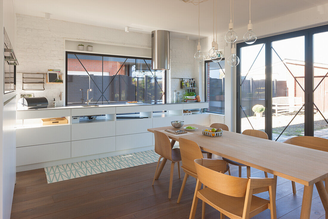 Open-plan kitchen and dining room with terrace view