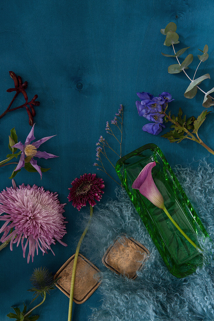 Flowers for making an autumn arrangement: chrysanthemum, calla lily, gerbera daisy, monkshood, eucalyptus, clematis, kangaroo paw and sea lavender