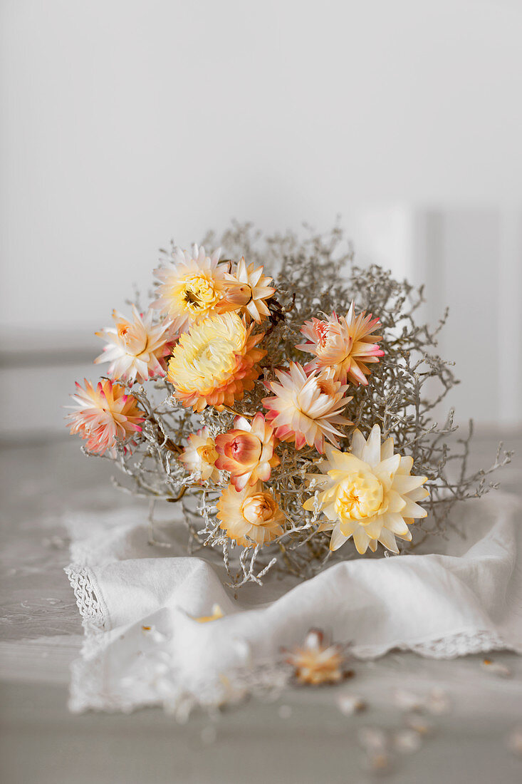 Ball of barbed wire place and dried everlasting flowers