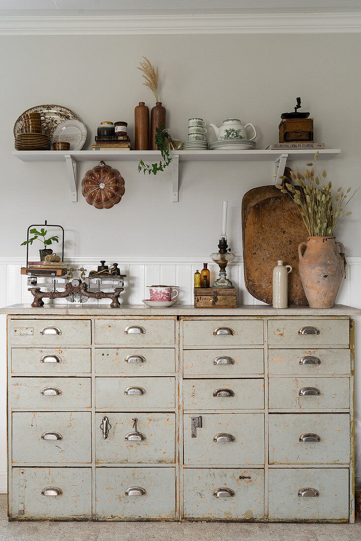 Old chest of drawers and rustic flea-market accessories
