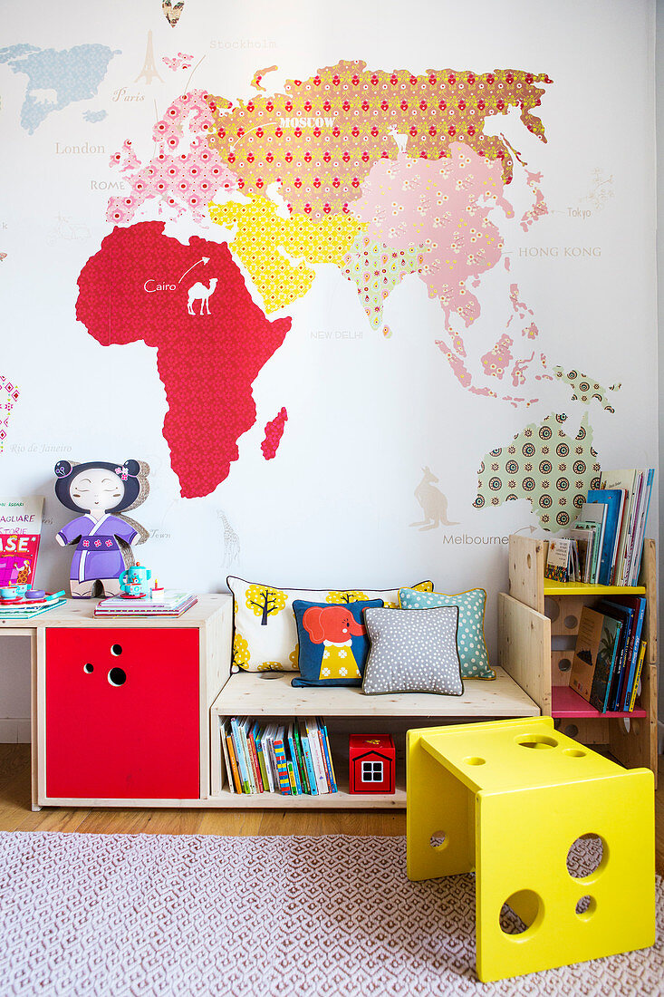 Colourful child's bedroom with DIY map of the world decorating wall
