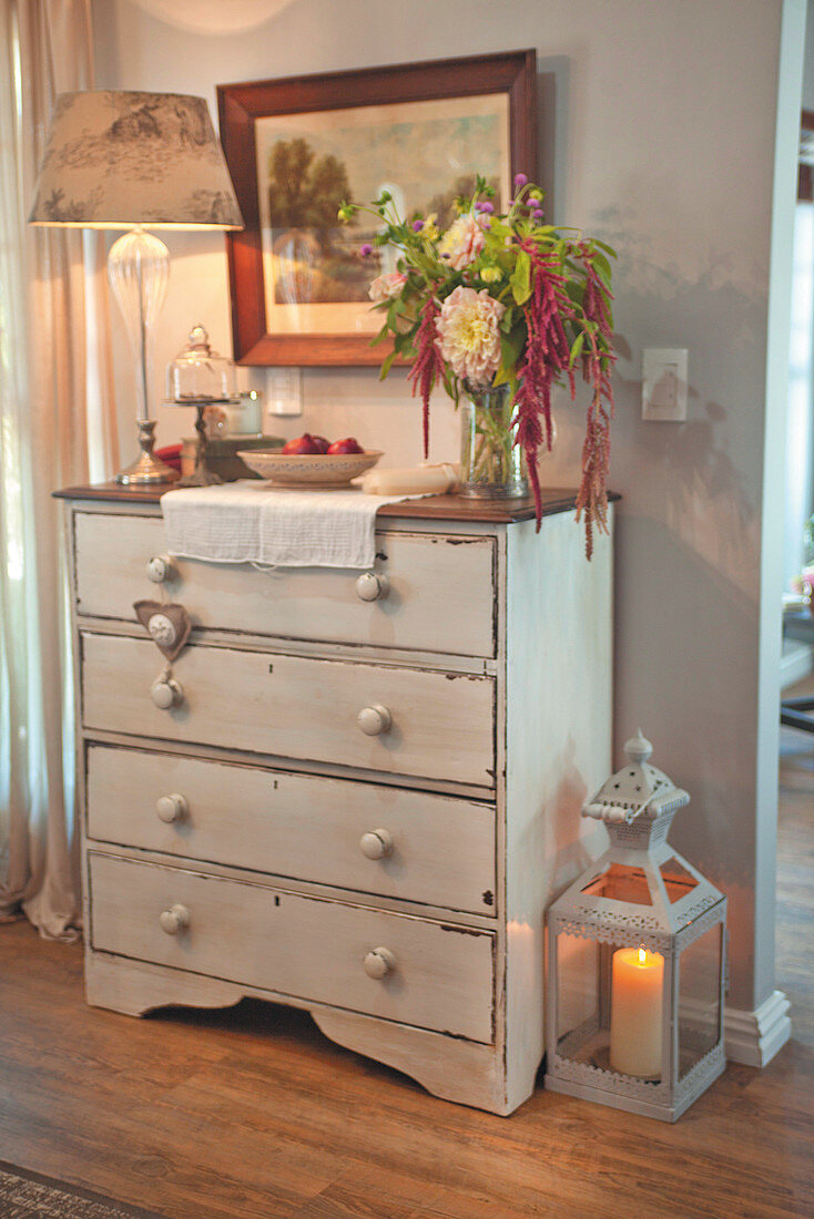 Shabby-chic chest of drawers with romantic accessories