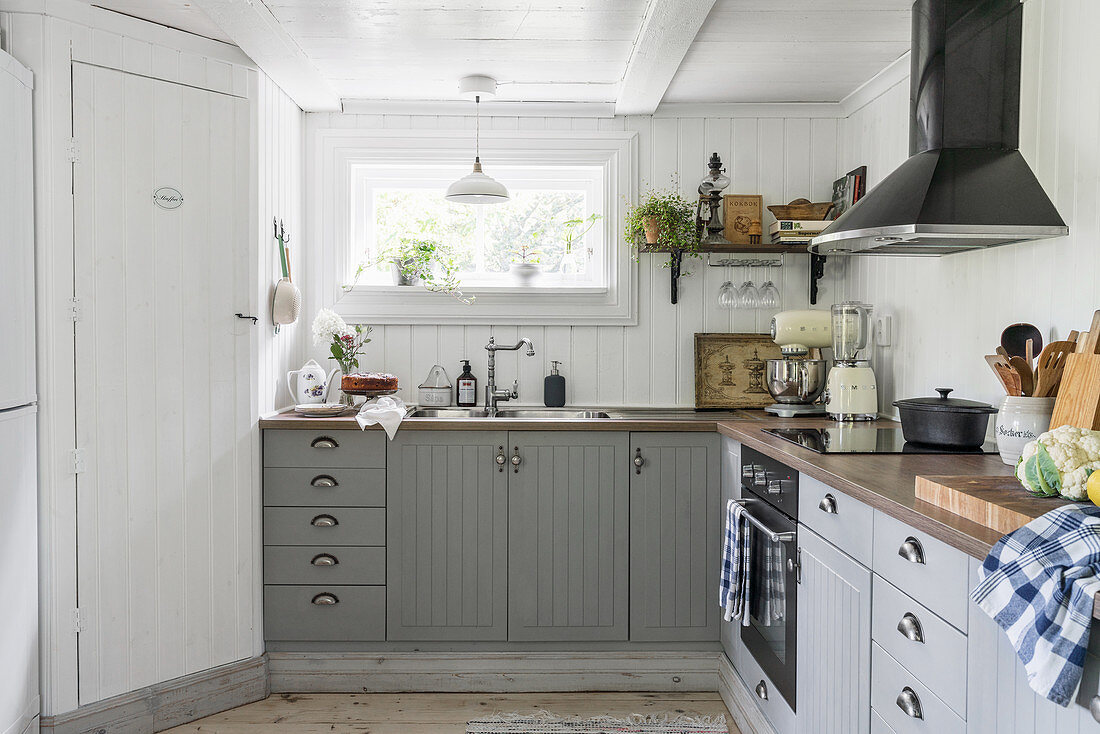 Grey, restored country-house kitchen