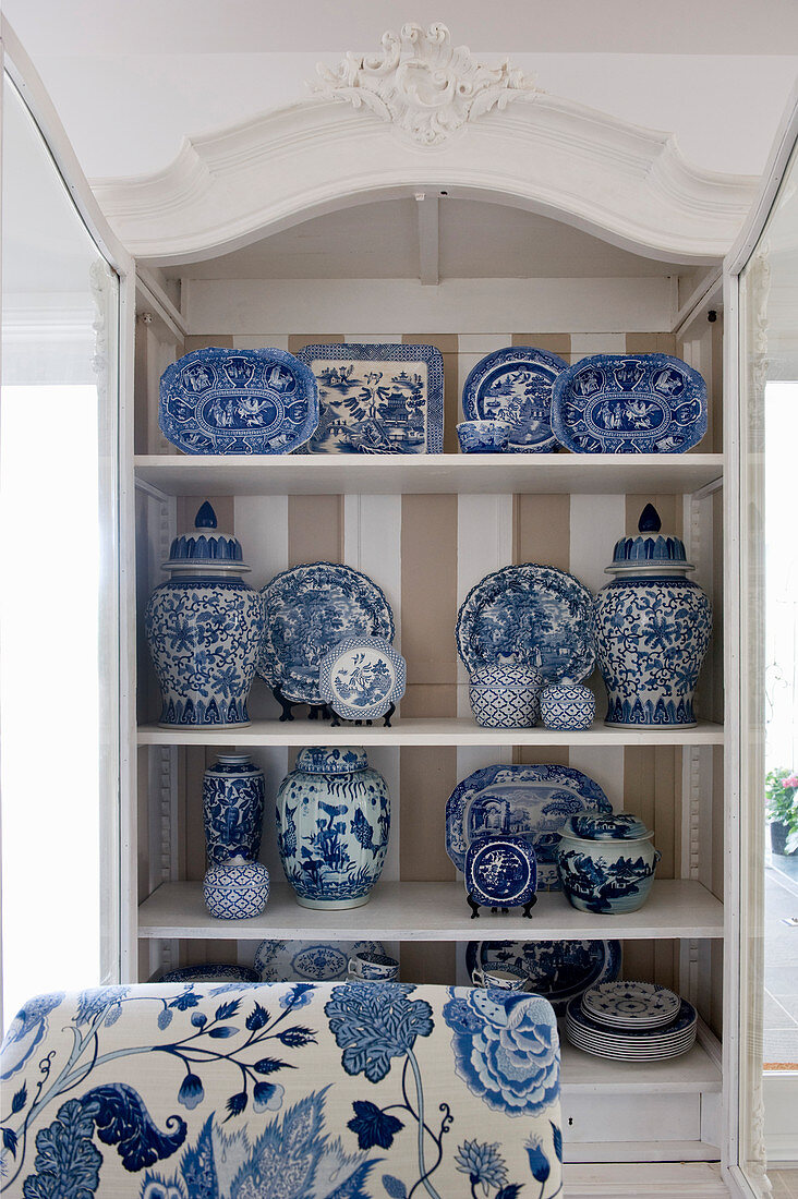 Blue-and-white china in cupboard