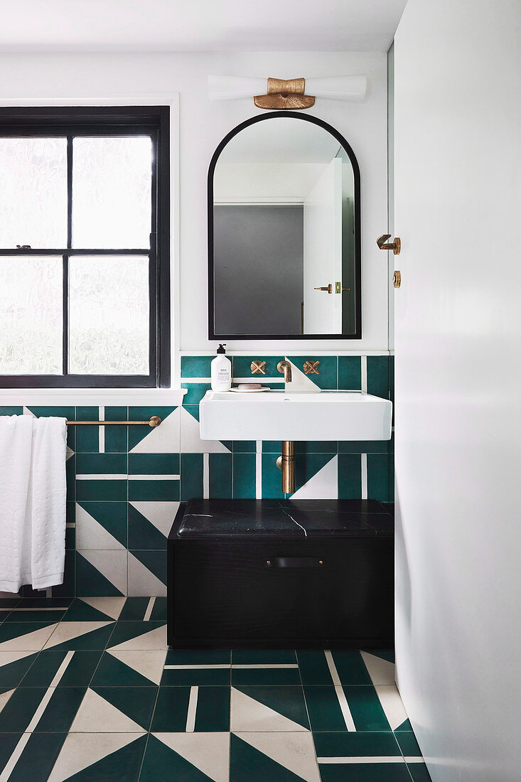 Bathroom with teal and white tiles