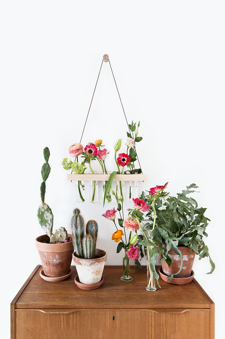 Summer flowers in DIY wall-mounted vases