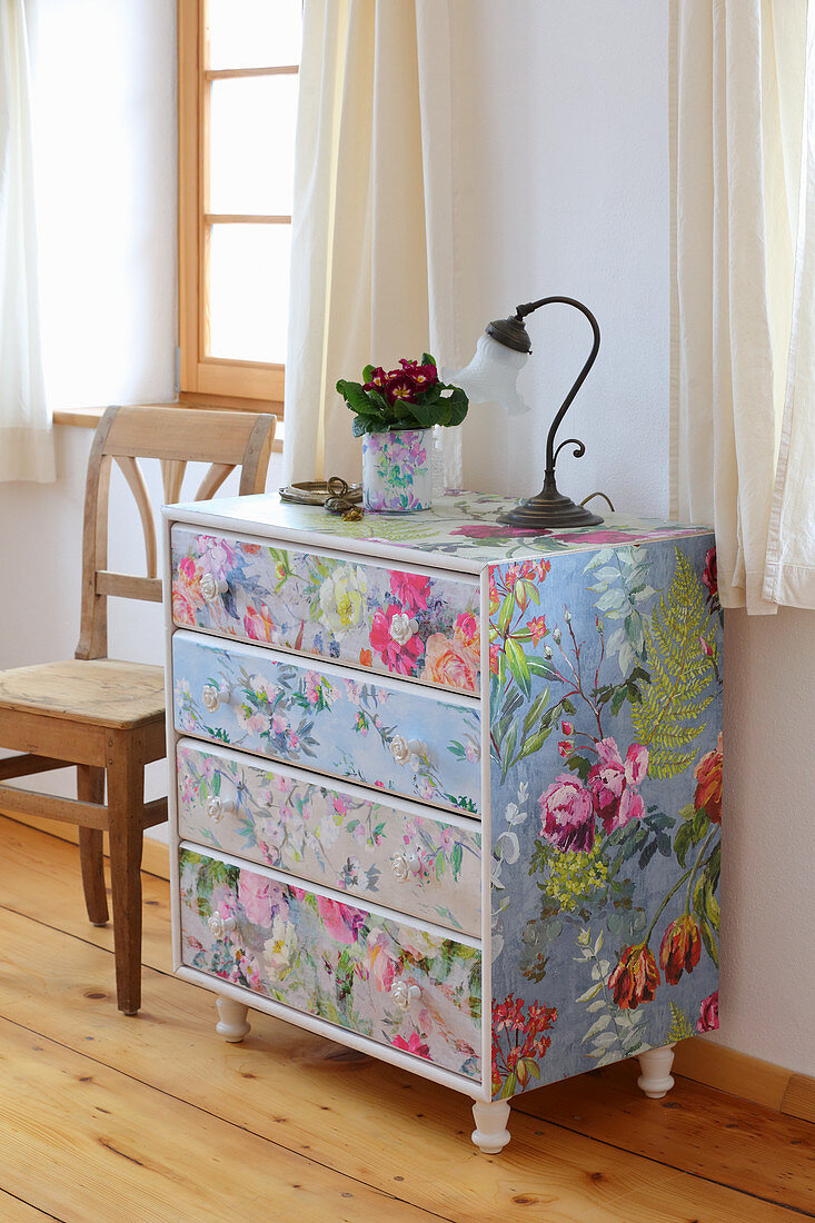 Redesign: wooden chest of drawers covered with floral wallpapers
