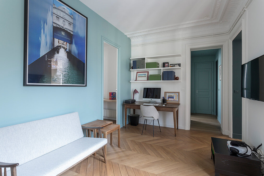 Pale blue wall in connecting room in French period building