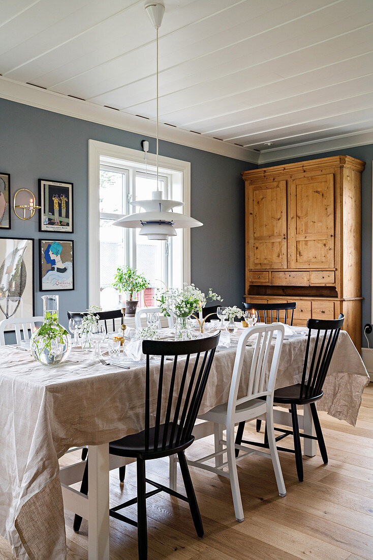 Festively set table in country-house-style dining room