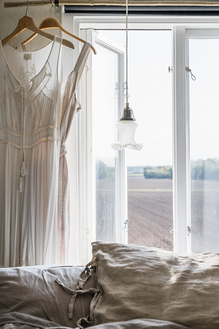 Lingerie by the window in the bedroom, view of fields