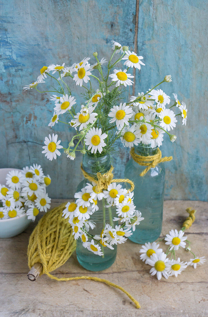 Arrangements and small wreath of chamomile flowers