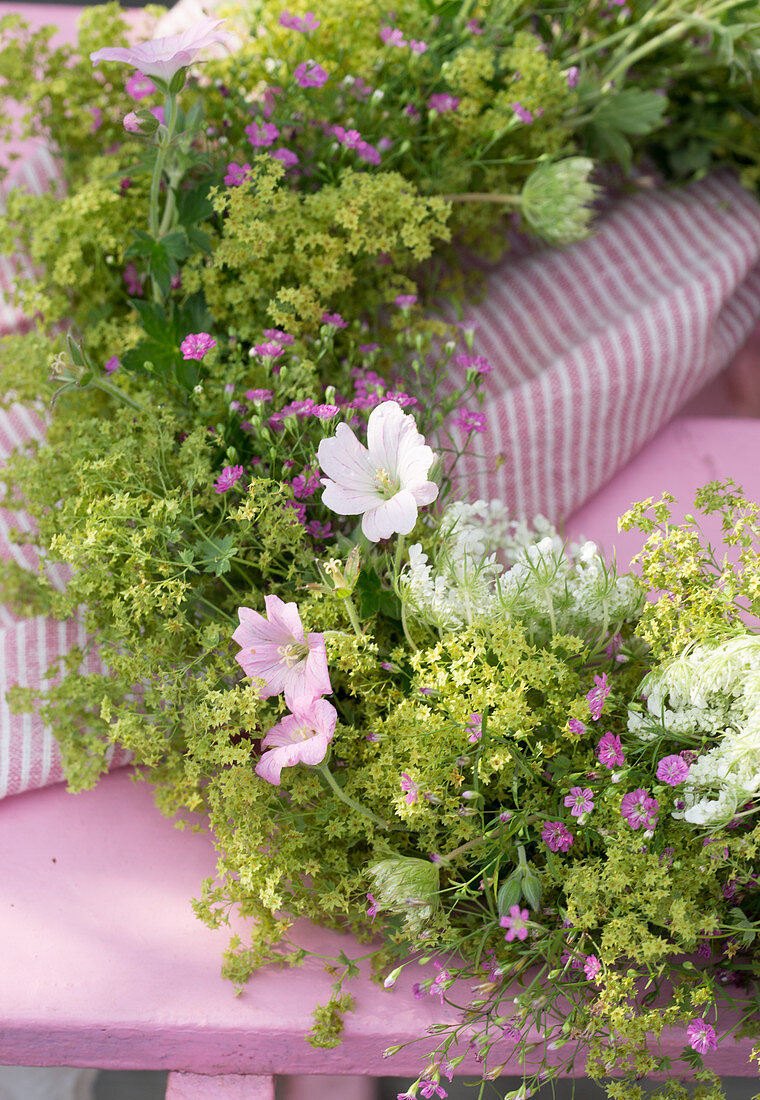 Wreath of lady's mantle, mallows, Queen Anne's lace and gypsophila