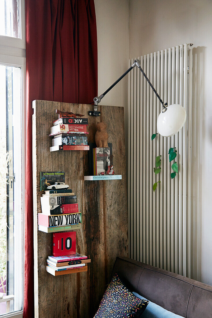 Bookshelves mounted on rustic wooden board
