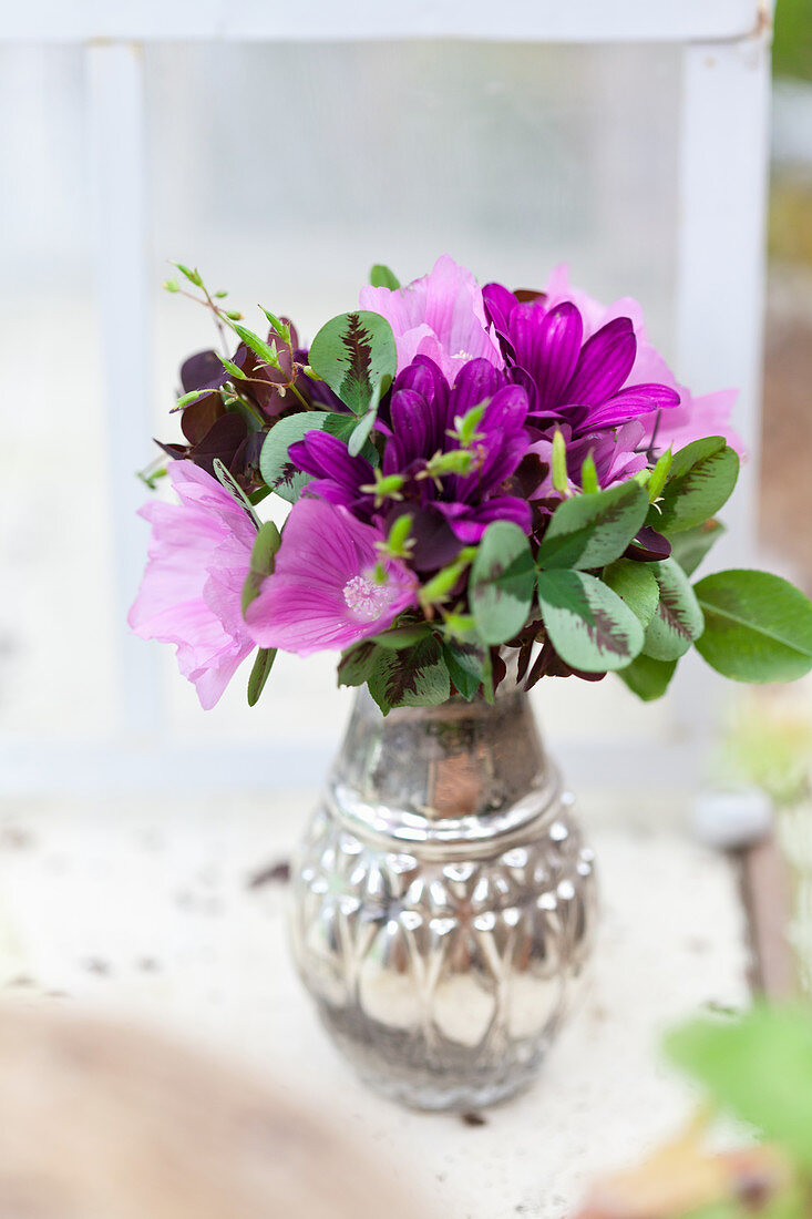 Posy of clover and purple flowers
