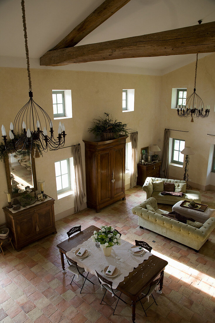 Open French country living room with lofted ceilings