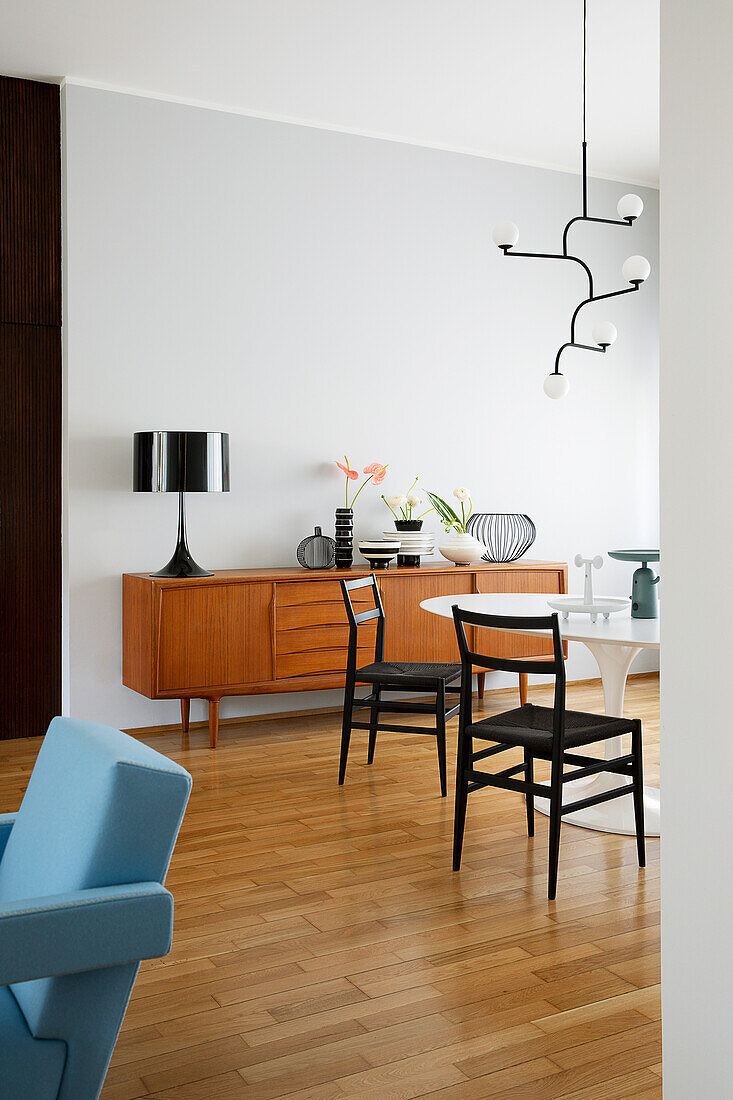Retro sideboard, classic table and chairs in living room