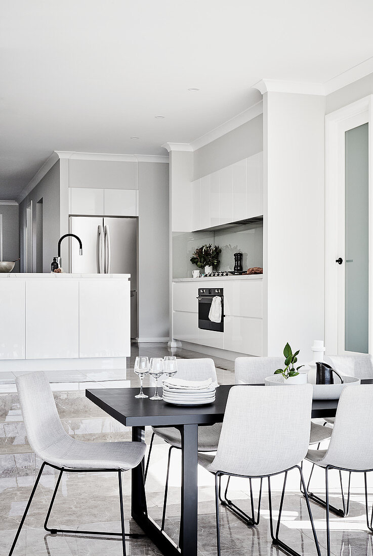 Modern, minimalist, open-plan interior in shades of grey