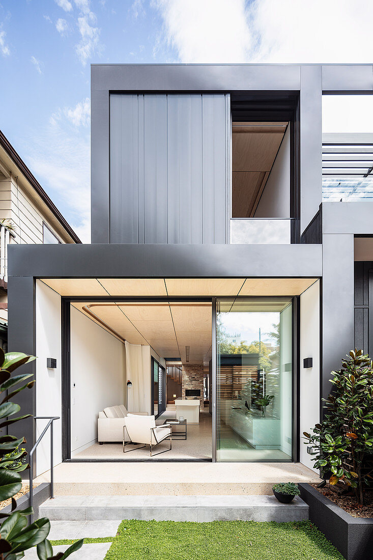 View from garden into modern, cubic, architect-designed house