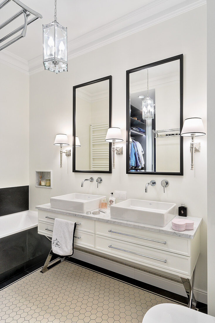 Twin sinks in elegant, classic, black-and-white bathroom
