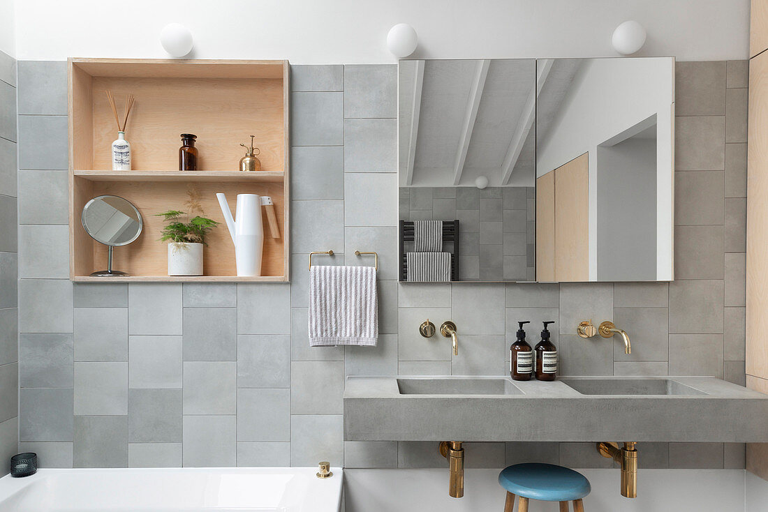 Shelves in niches and twin sinks in grey, modern bathroom