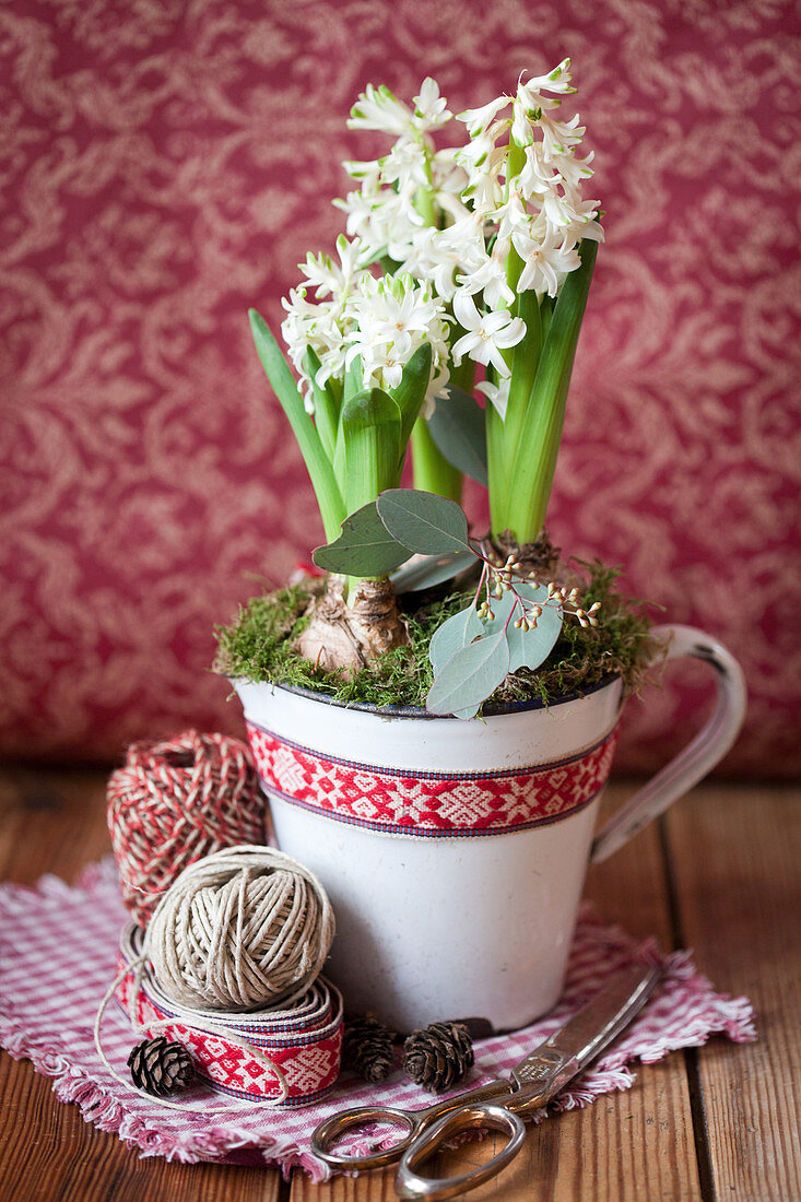 Hyacinths in an enamel mug