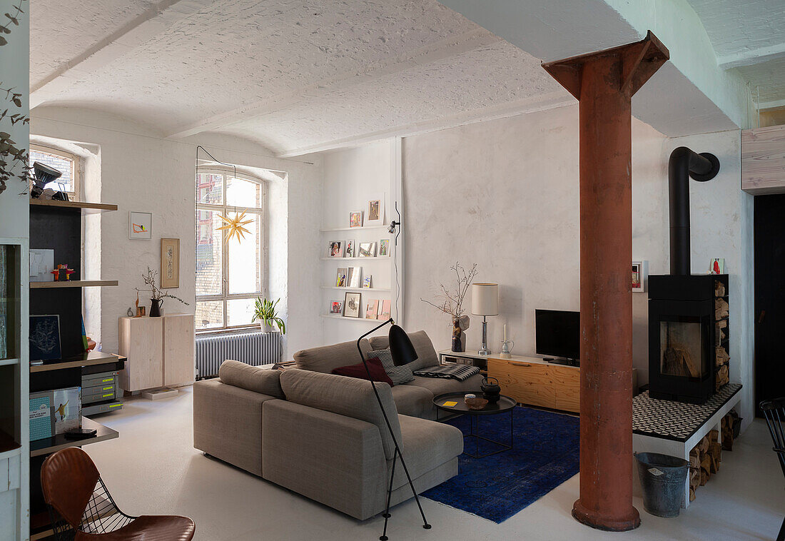 Living room in a vintage style in old building with a vaulted ceiling