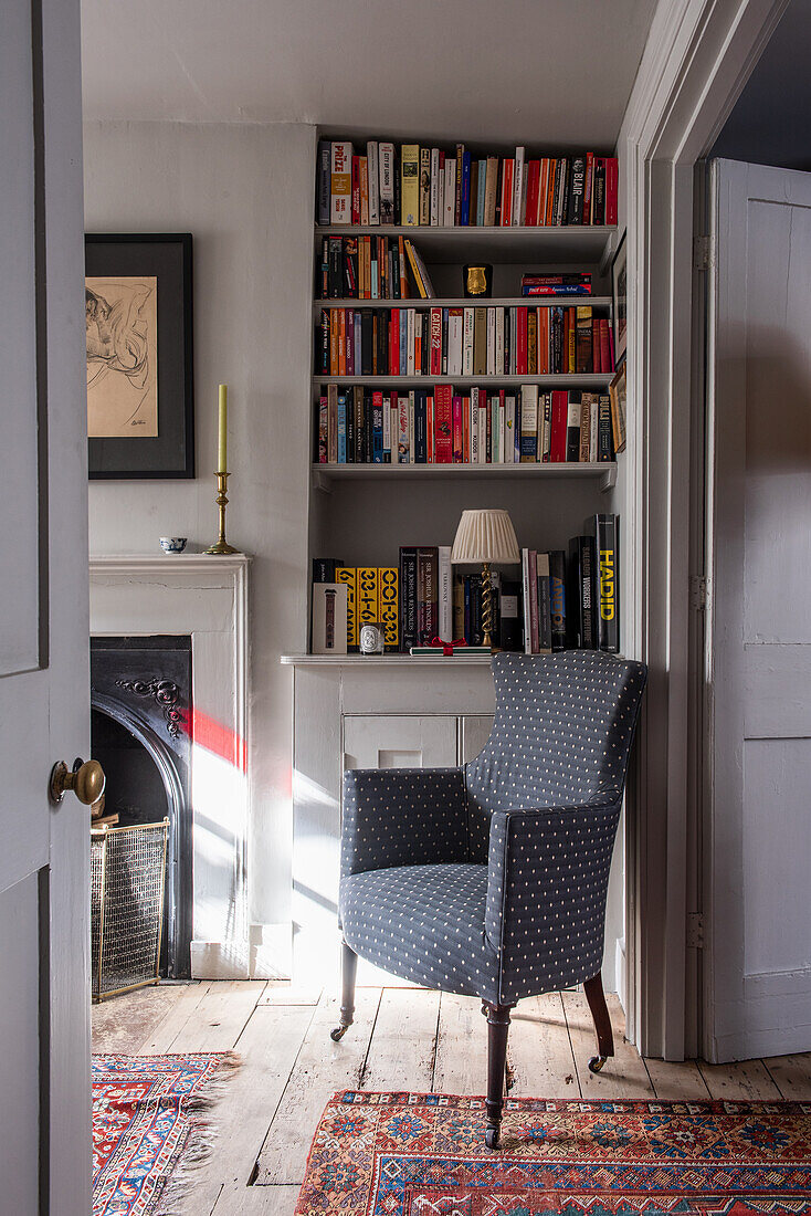 Accent chair in front of bookshelf