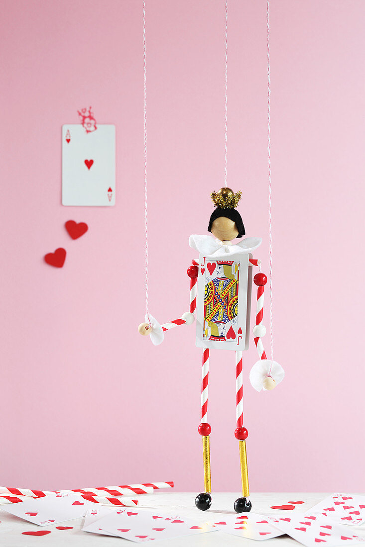 Handmade puppet made from playing cards and drinking straws