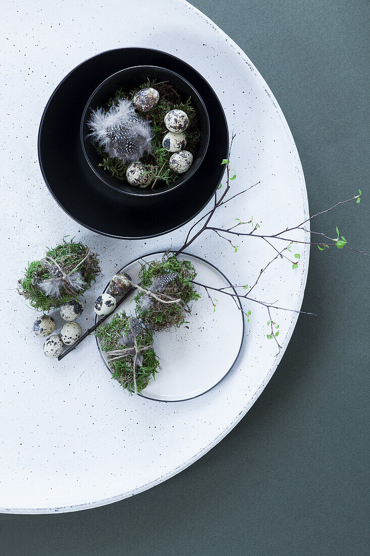 Easter decoration with moss and quail eggs