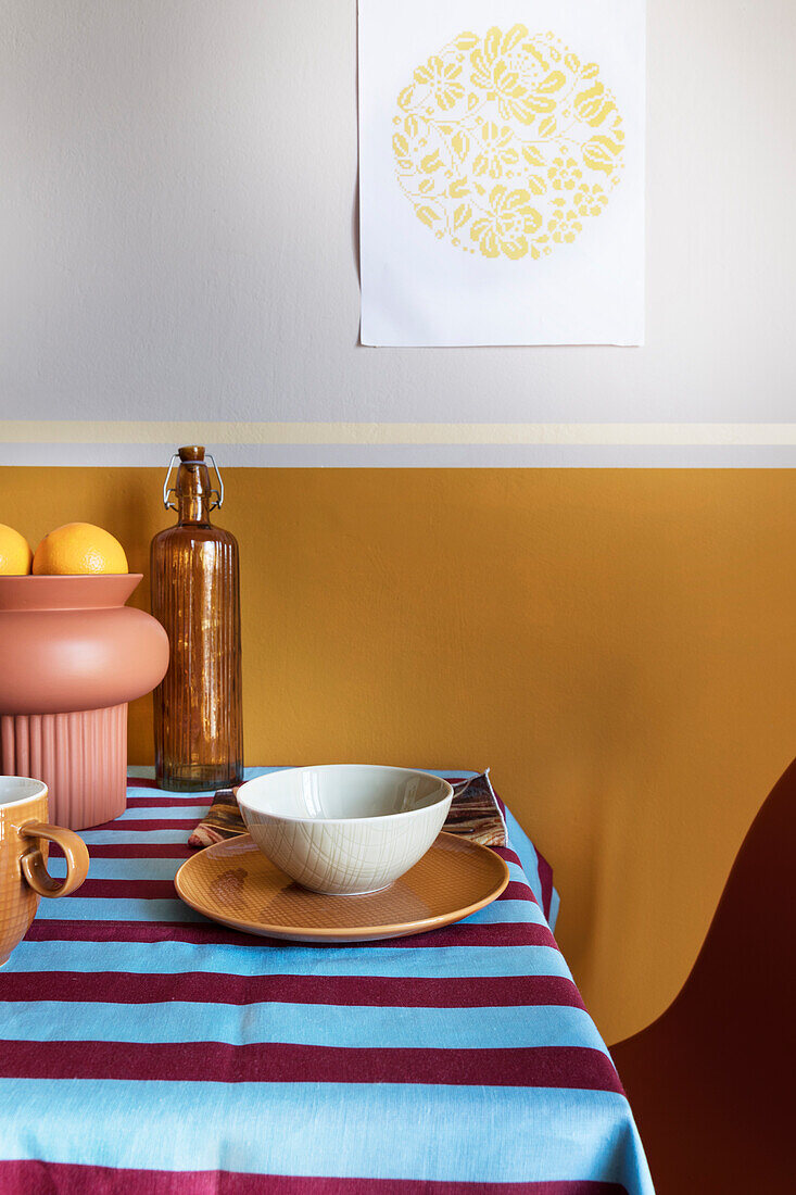 Breakfast on table with striped tablecloth