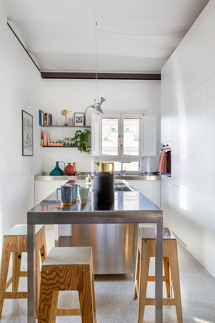 Steel center block and wooden stool in the kitchen