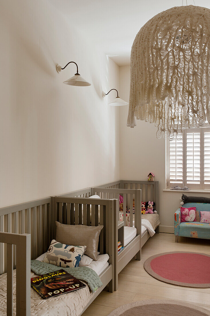 Cot-style twin beds in childrens bedroom