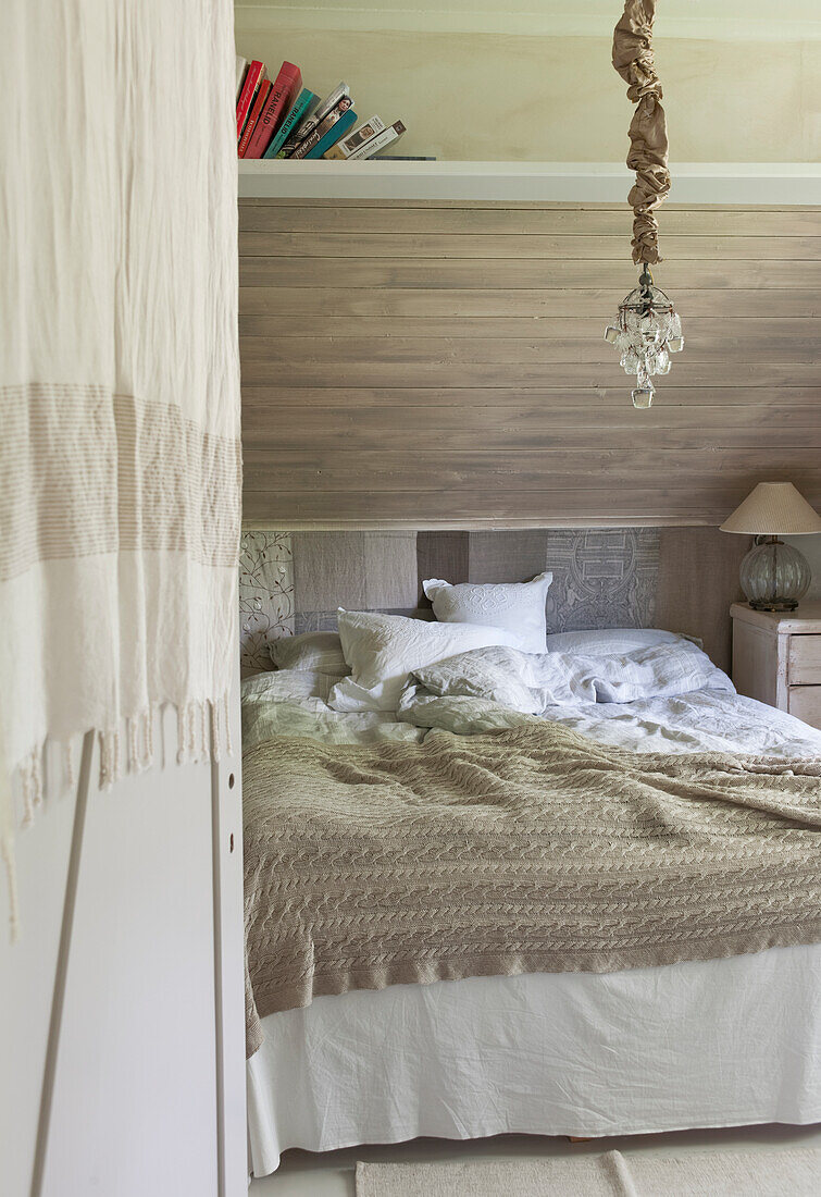 Double bed in a bedroom in shades of beige and grey (greige)